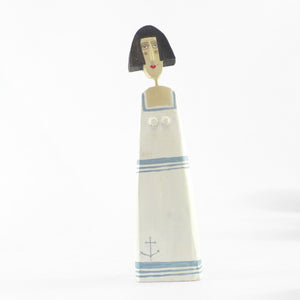 Small figure in a white sailor frock