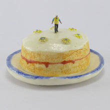 Load image into Gallery viewer, Victoria Sponge being inspected by a workman