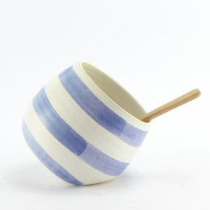 Blue and white salt pig with wooden spoon