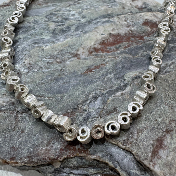 Small silver cinnamon swirl necklace