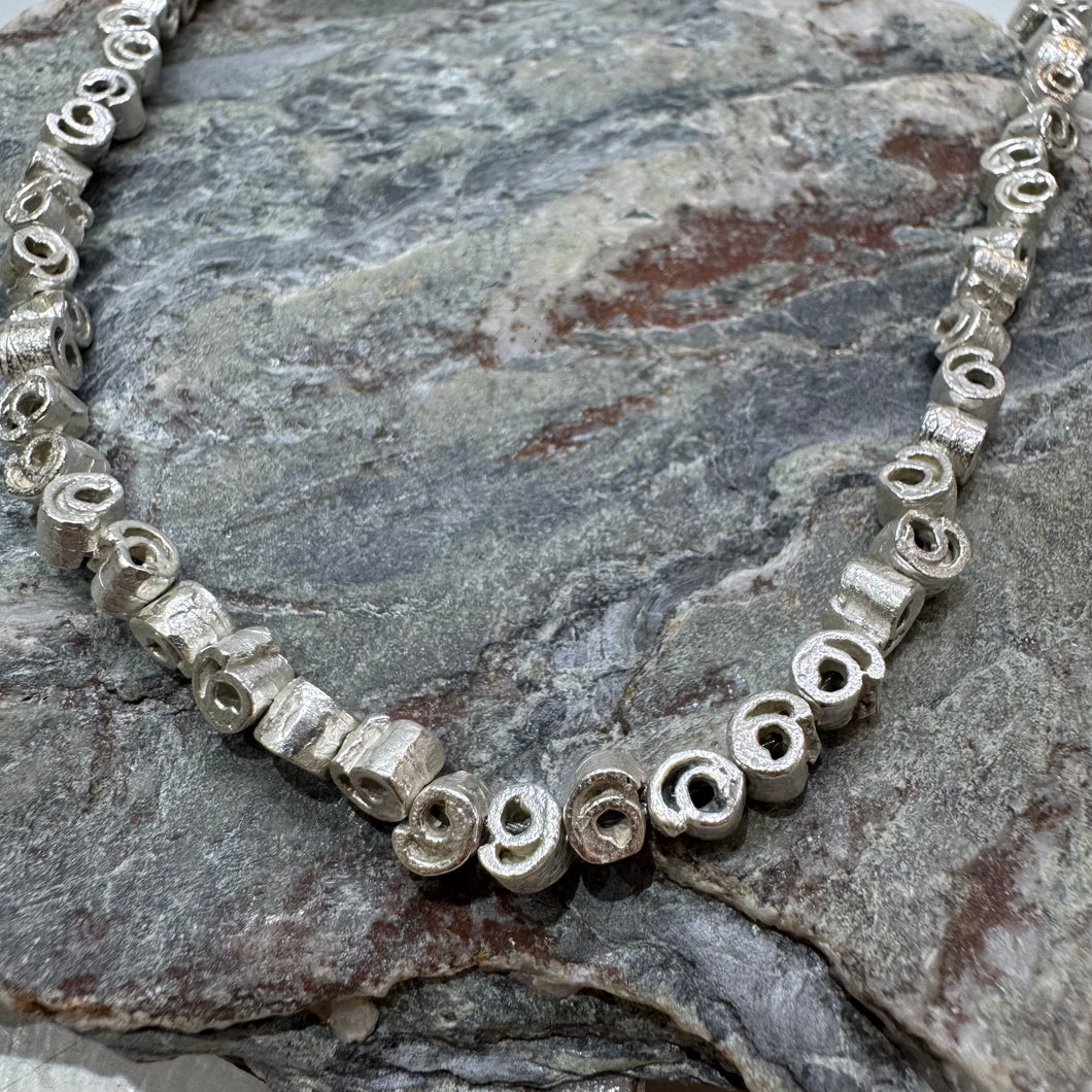 Small silver cinnamon swirl necklace