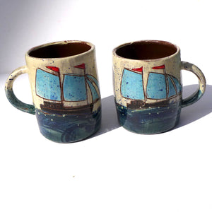 Mug with turquoise sails