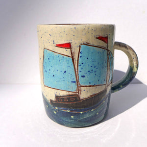 Mug with turquoise sails