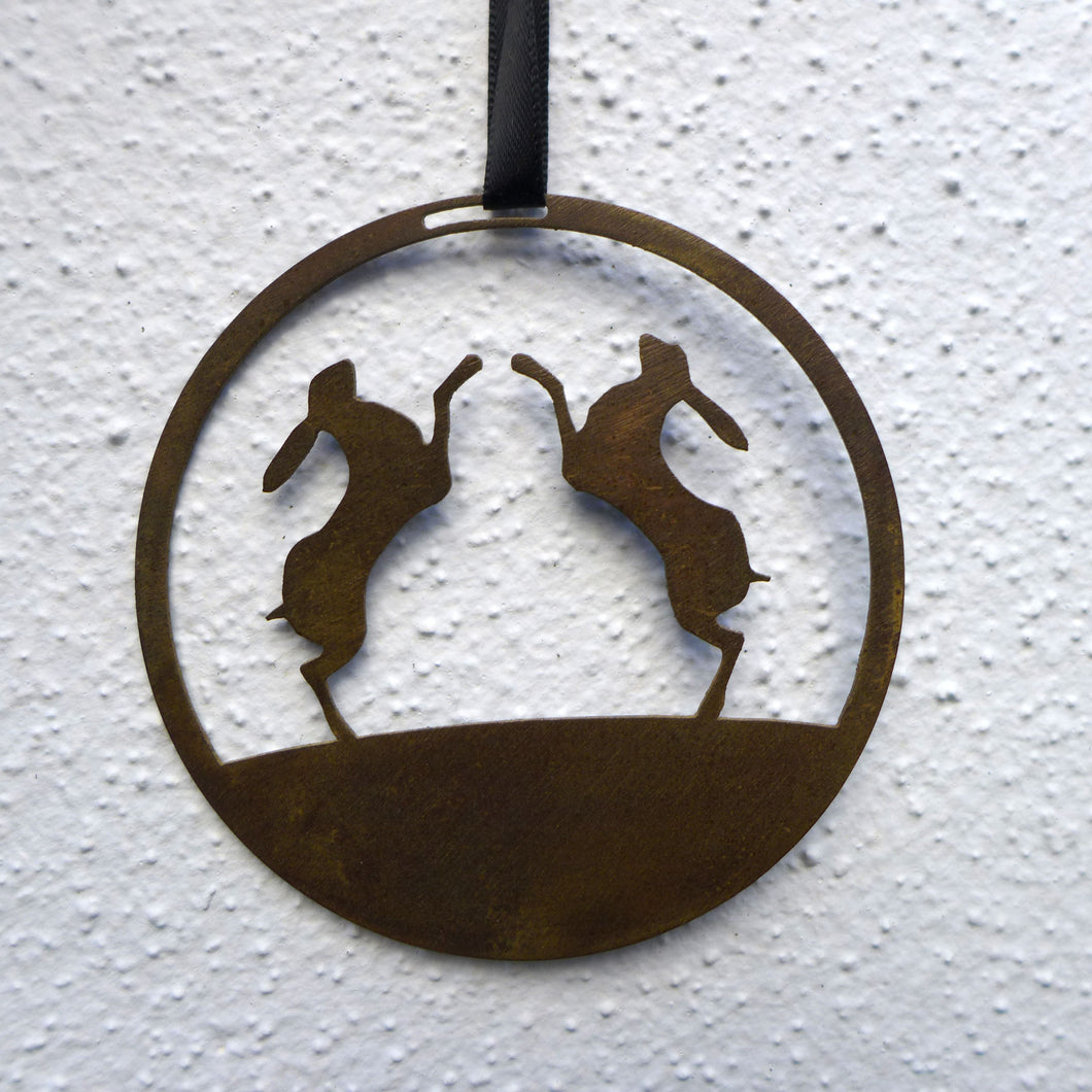 Boxing hares hanging