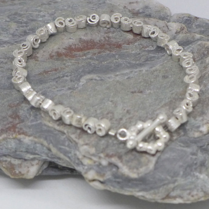 Small silver cinnamon swirl bracelet