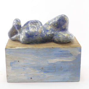 Fii sculpture on a blue wood plinth