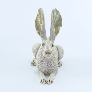 Small crouching hare white