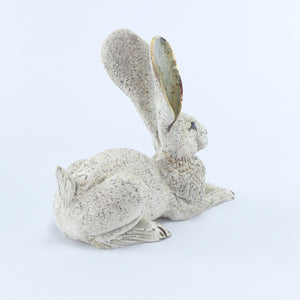 Small crouching hare white