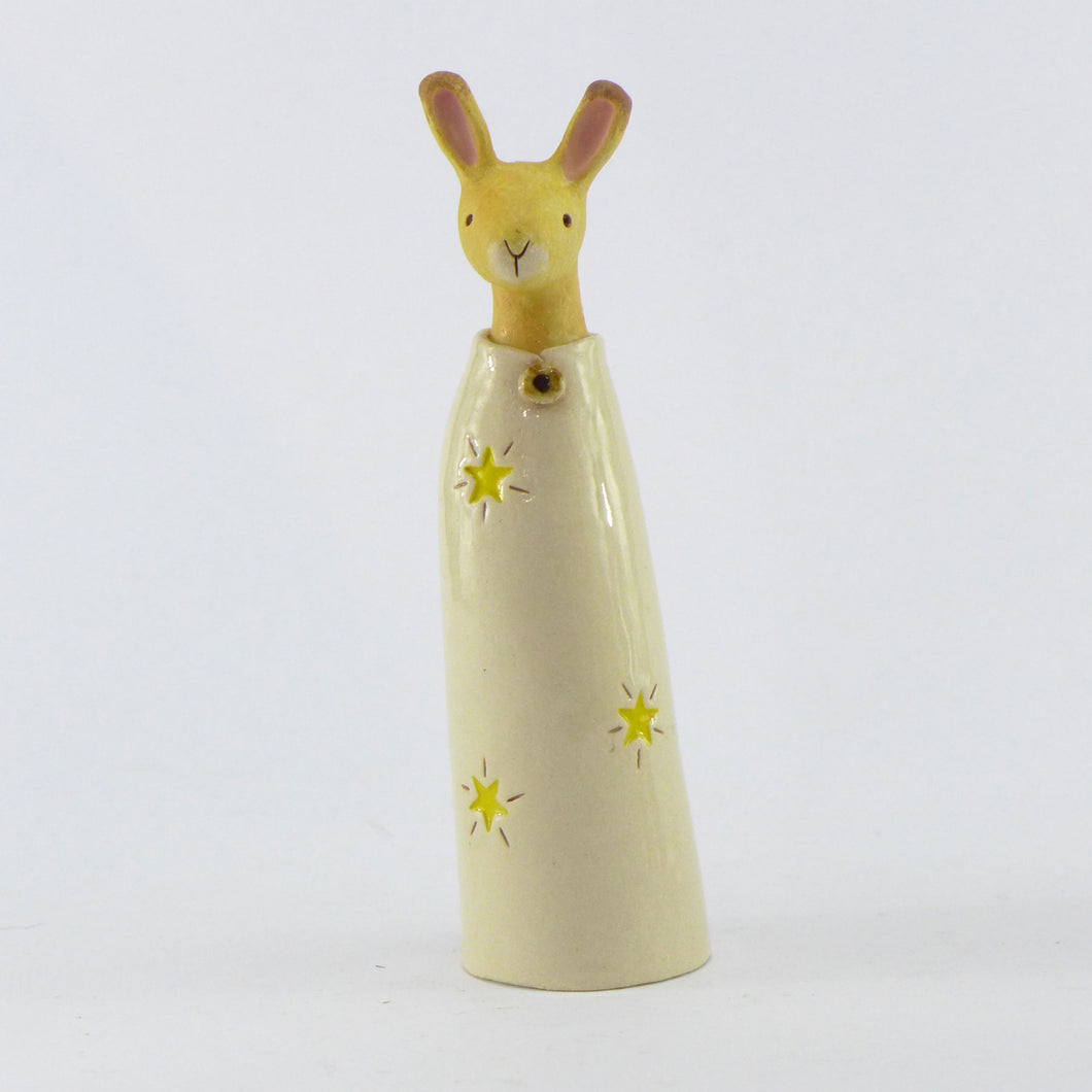 Ceramic golden hare in a starry coat