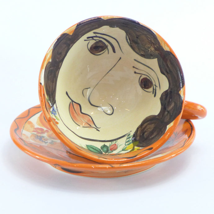 Orange cup and saucer
