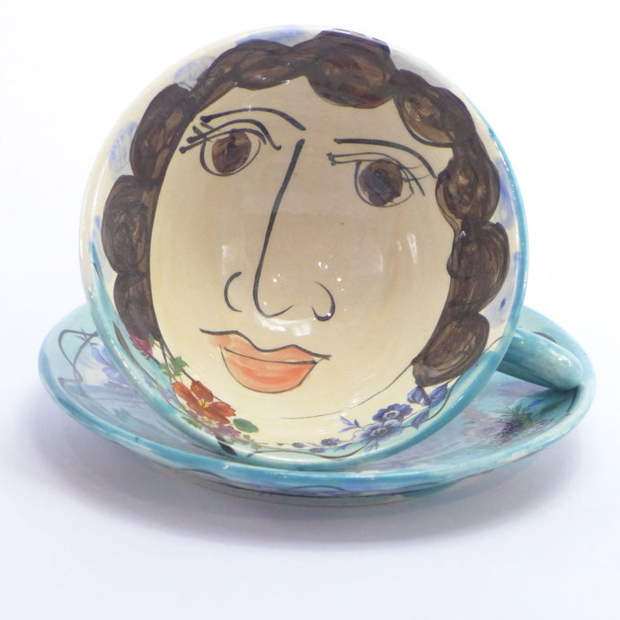 Turquoise cup and saucer