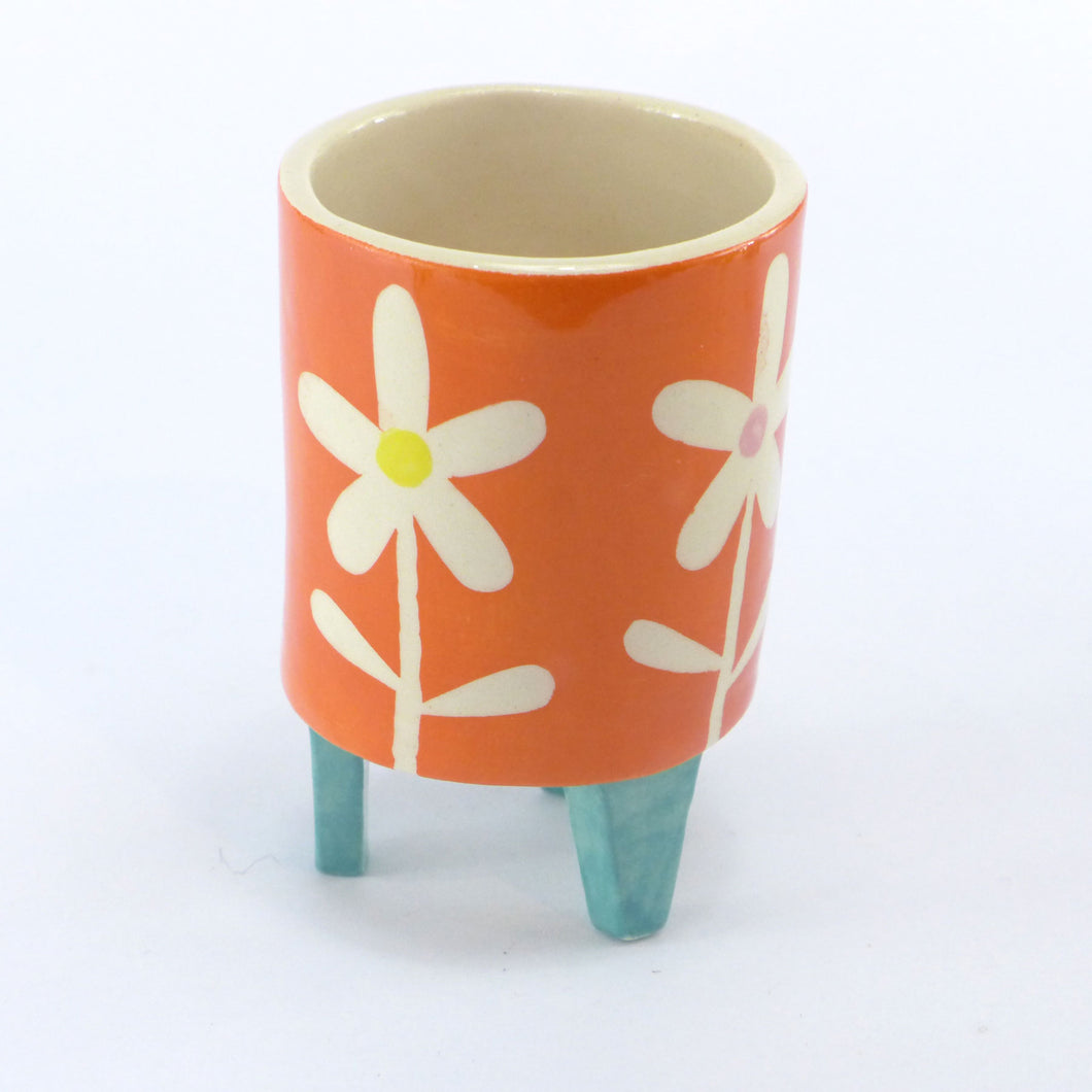Orange daisy baby planter
