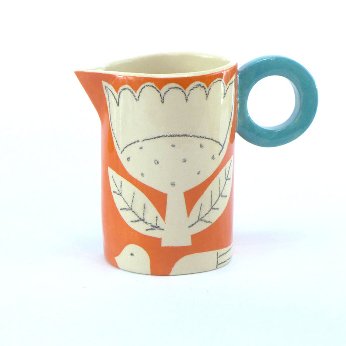 Orange patchwork baby jug