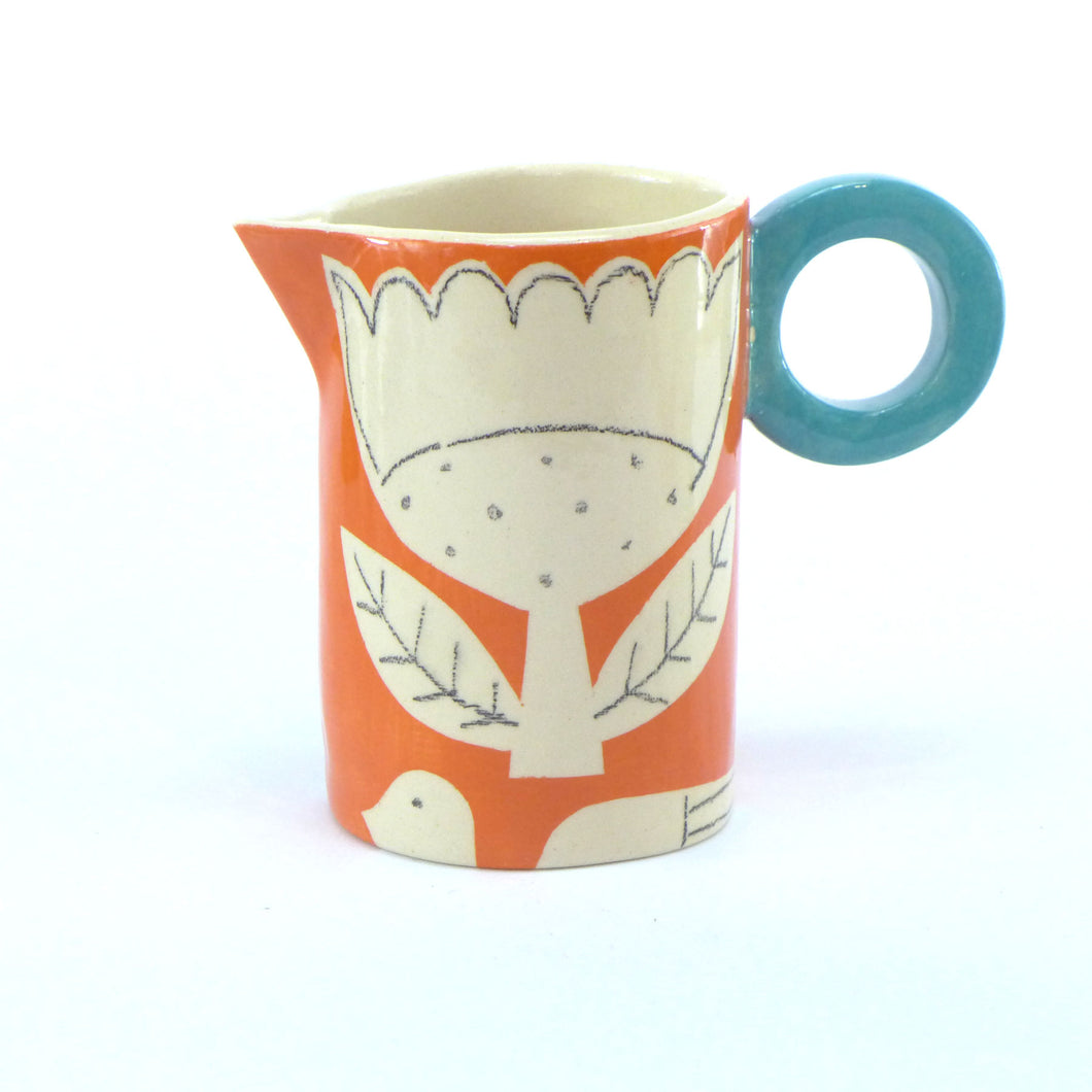 Orange patchwork baby jug