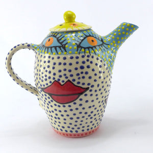 Eyes and lips tea pot