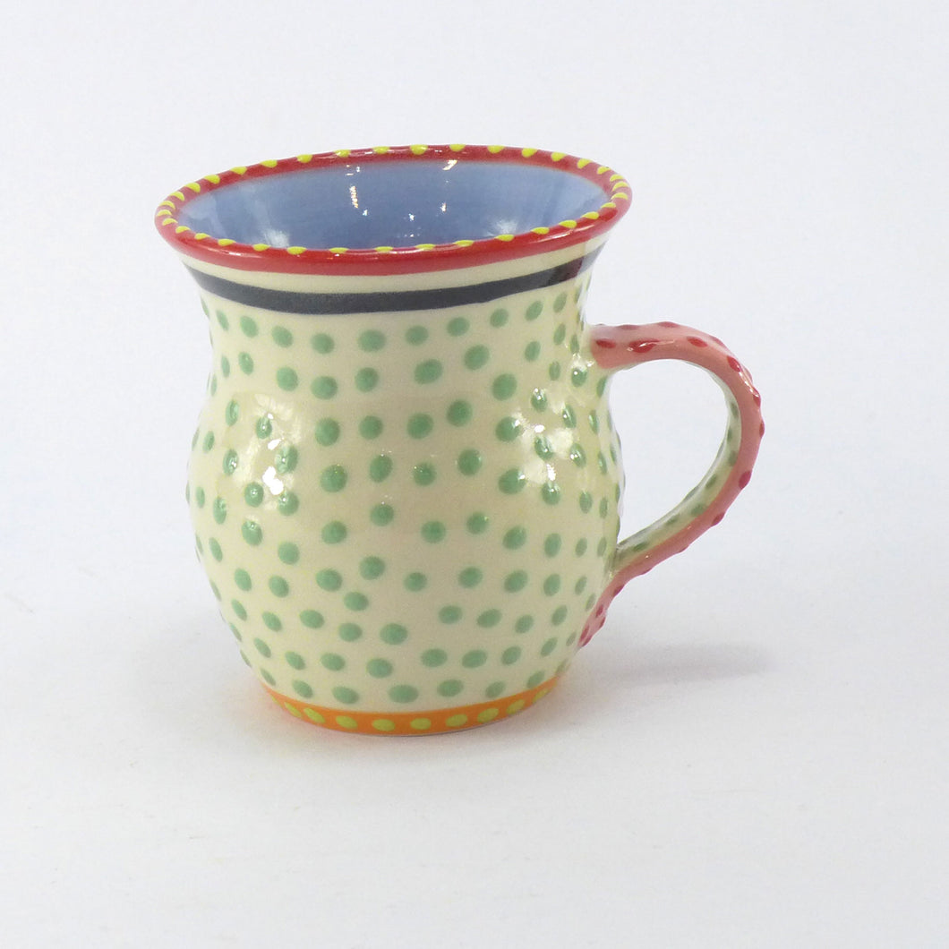 Pale green spotty mug