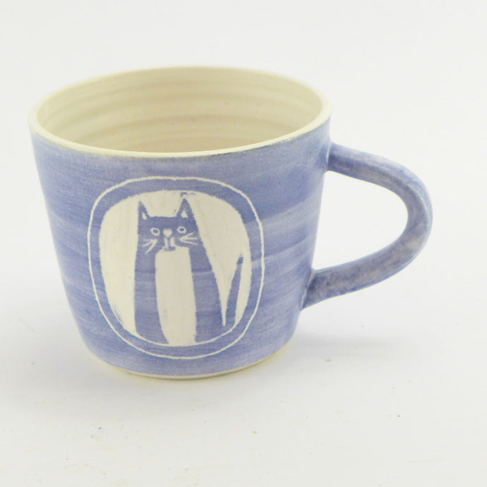 Blue and white mug with cat