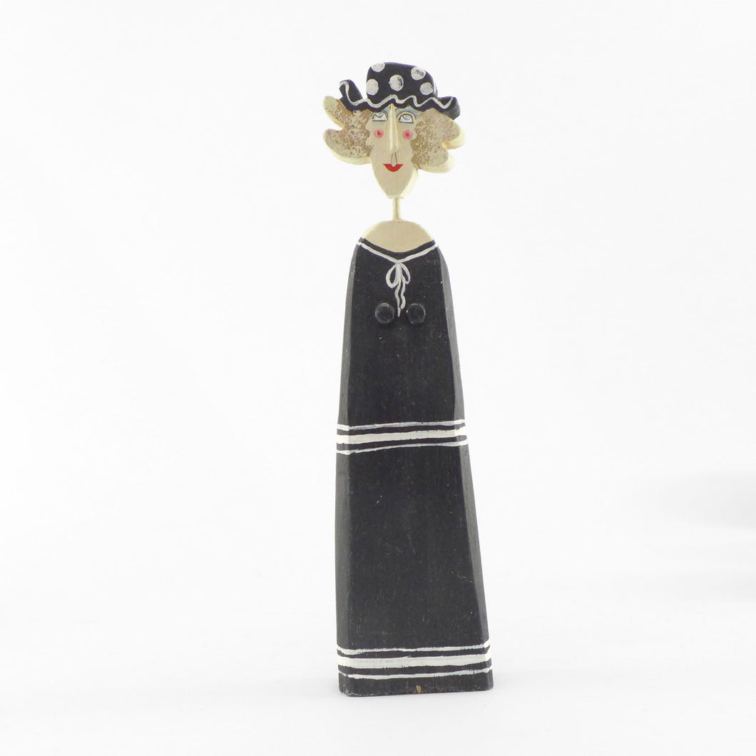 Small figure in a black sailor frock