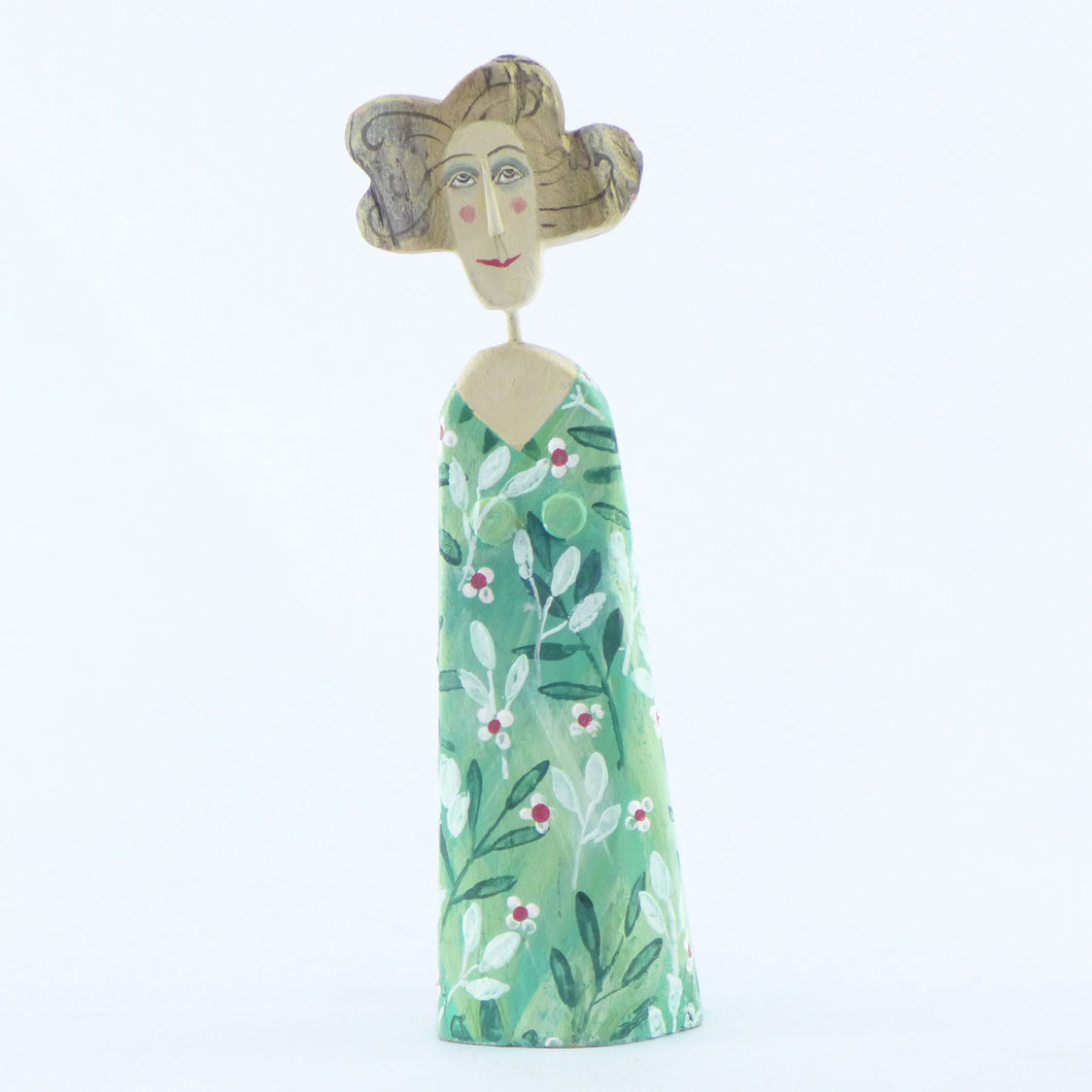 Small blonde in a green large daisy frock