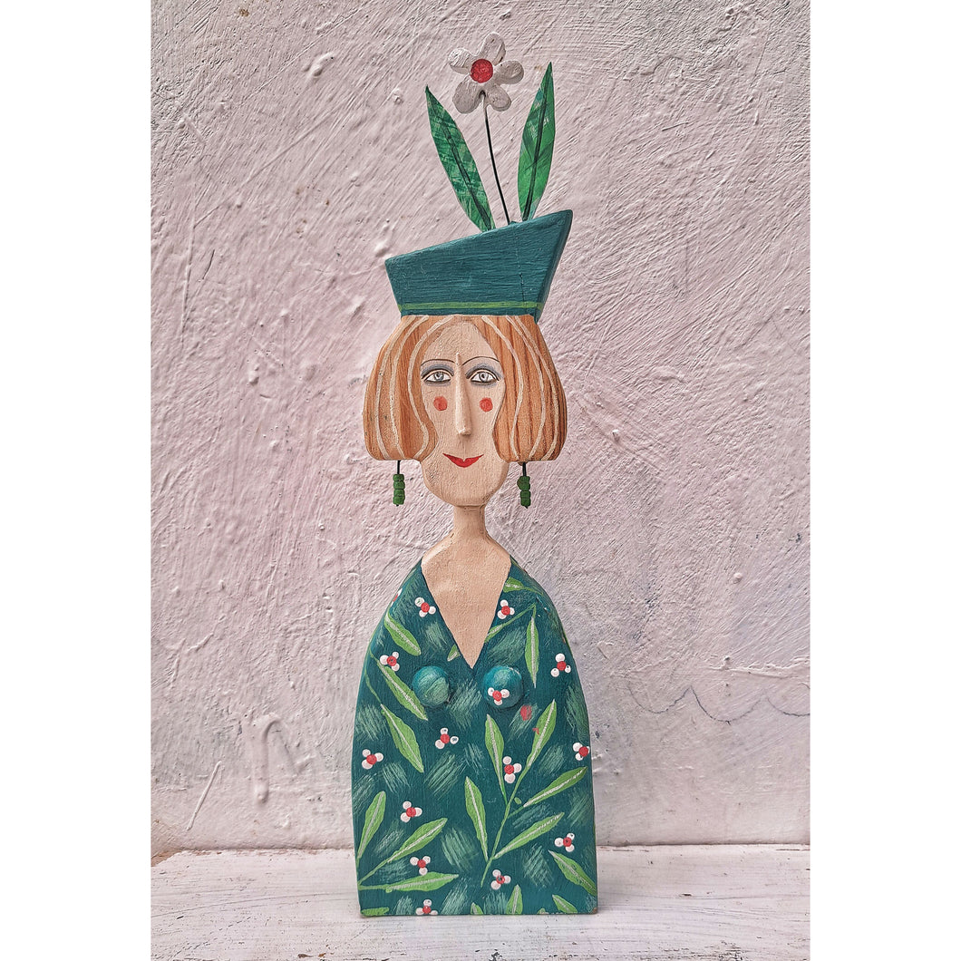 Lady with earrings & a green hat