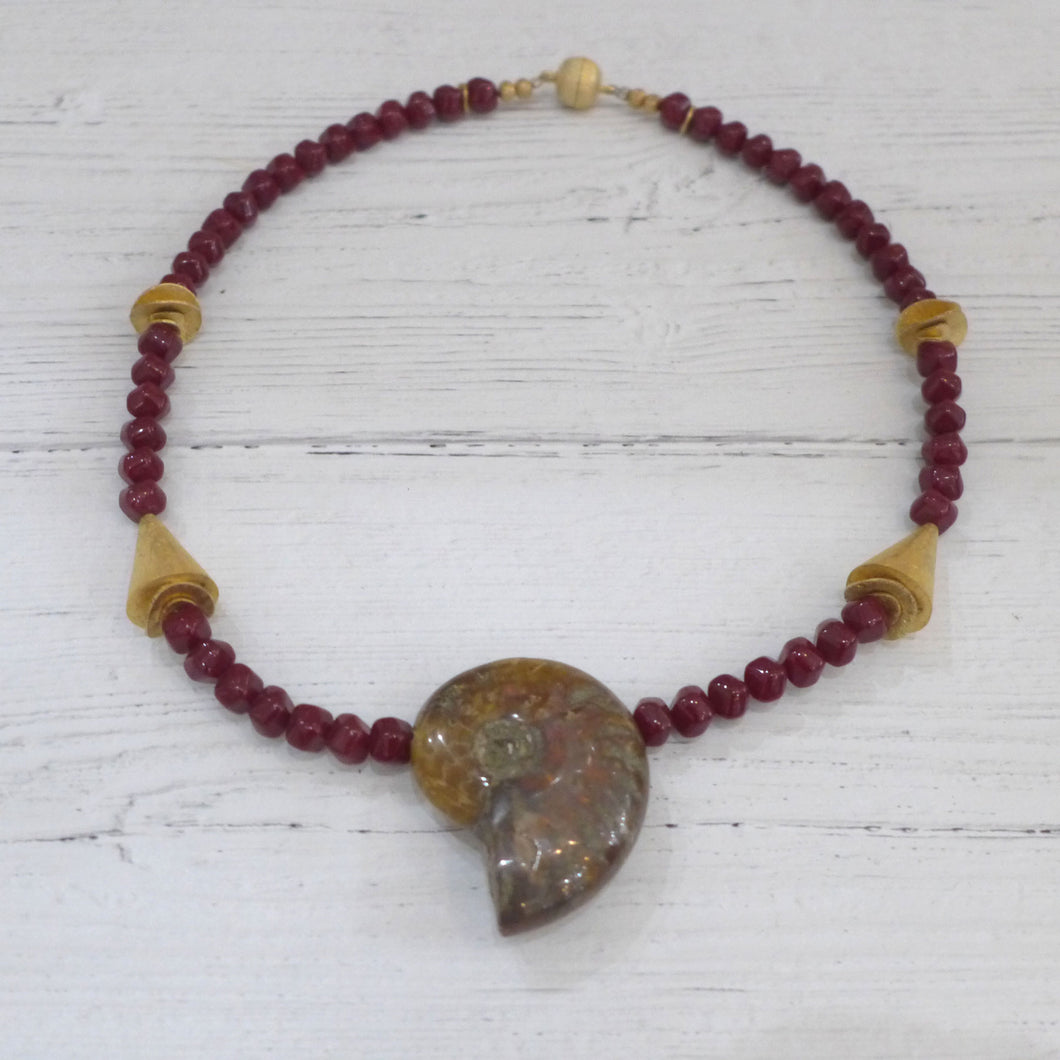 Ammonite, garnet coloured glass and gold plated silver necklace Rokz 4