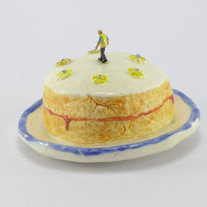 Victoria Sponge being inspected by a workman