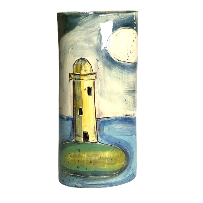 Cylindrical vase with a lighthouse design on a plain background