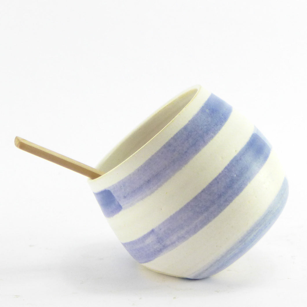 Blue and white salt pig with wooden spoon