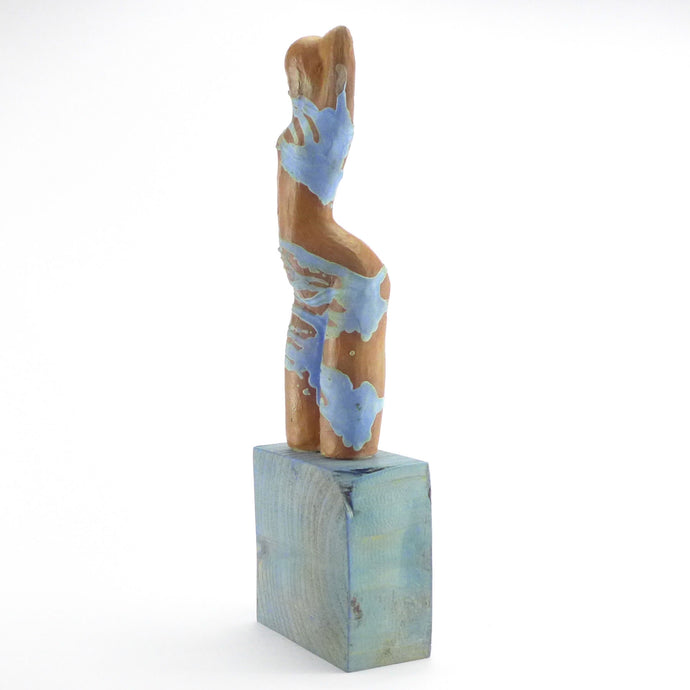 Lala sculpture on blue base
